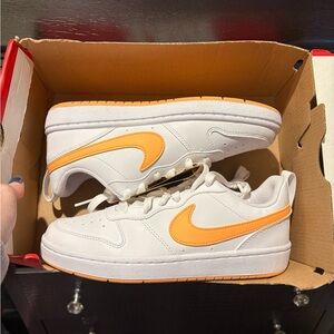 Nike Court Borough Low trainers in white and orange